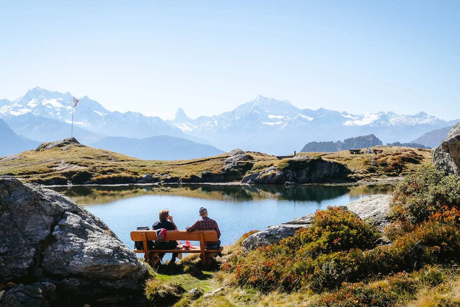 A couple at Blausee overlooking Matterhorn