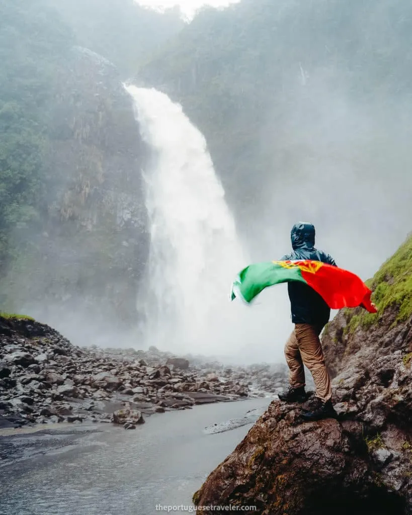 Me showcasing my Portuguese flag at the Cascada Magica del Rio Malo Waterfall