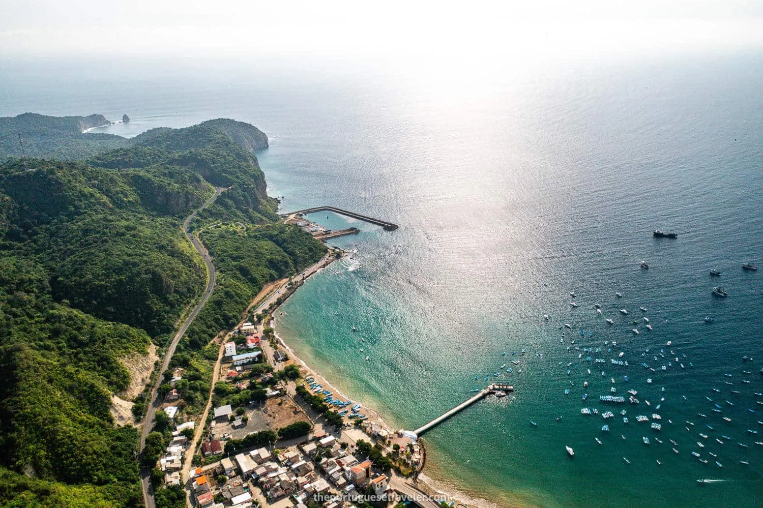 Puerto Lopez at sunset with the pier and Mares Ecuador building