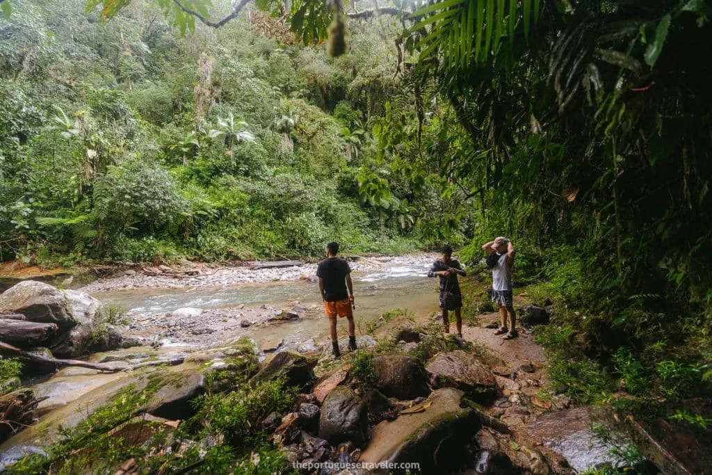 Waiting for the guide to help us cross the river to reach Gruta de Los Tayos