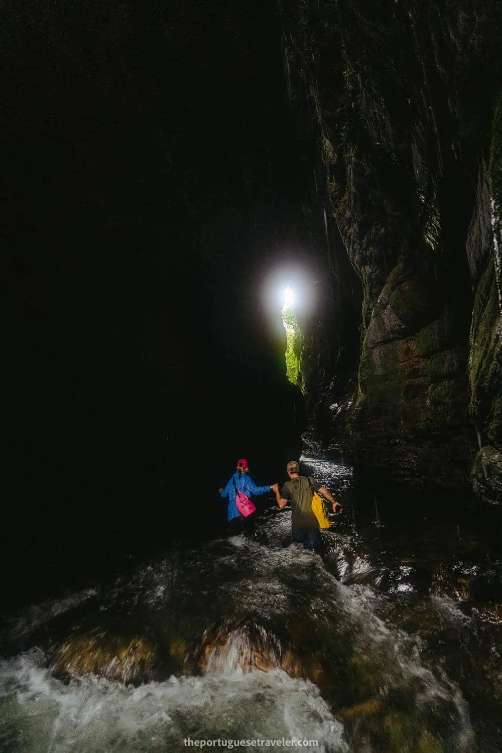 The knee deep water of Gruta de Los Tayos