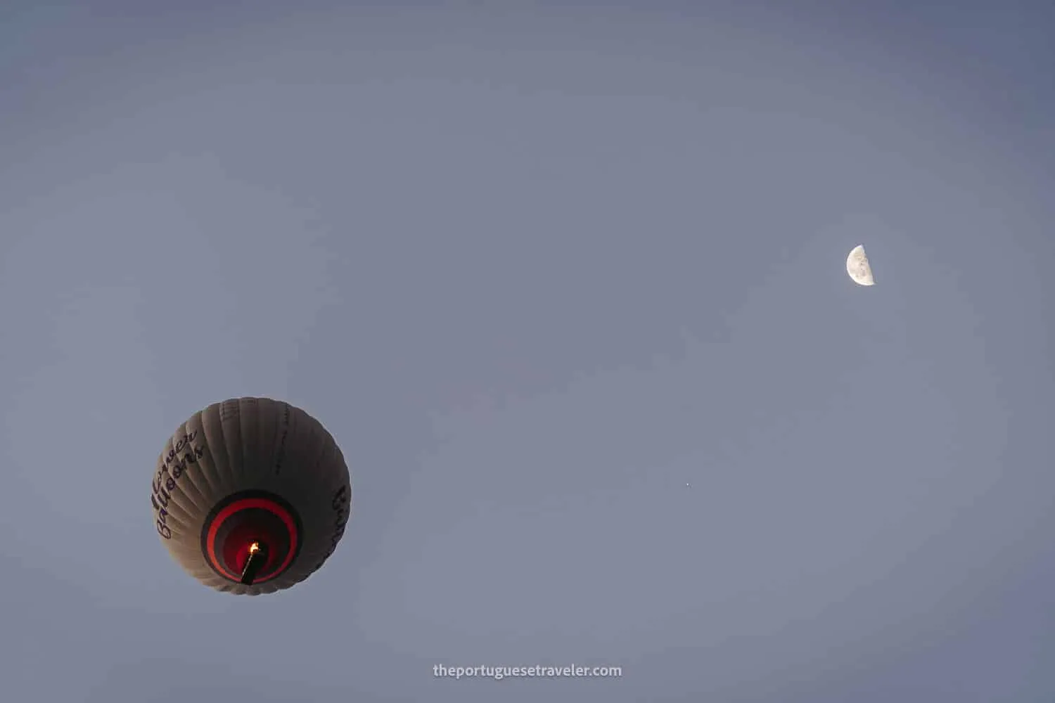 A hot air balloon and the moon in Cappadocia