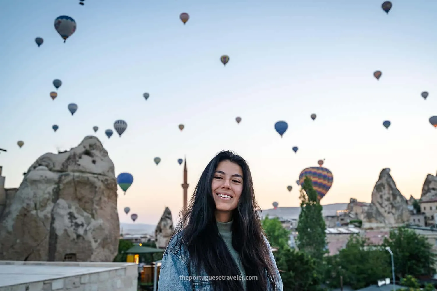 Jhos at Göreme Escape Suites's terrace watching the hot air balloons at sunrise in Cappadocia