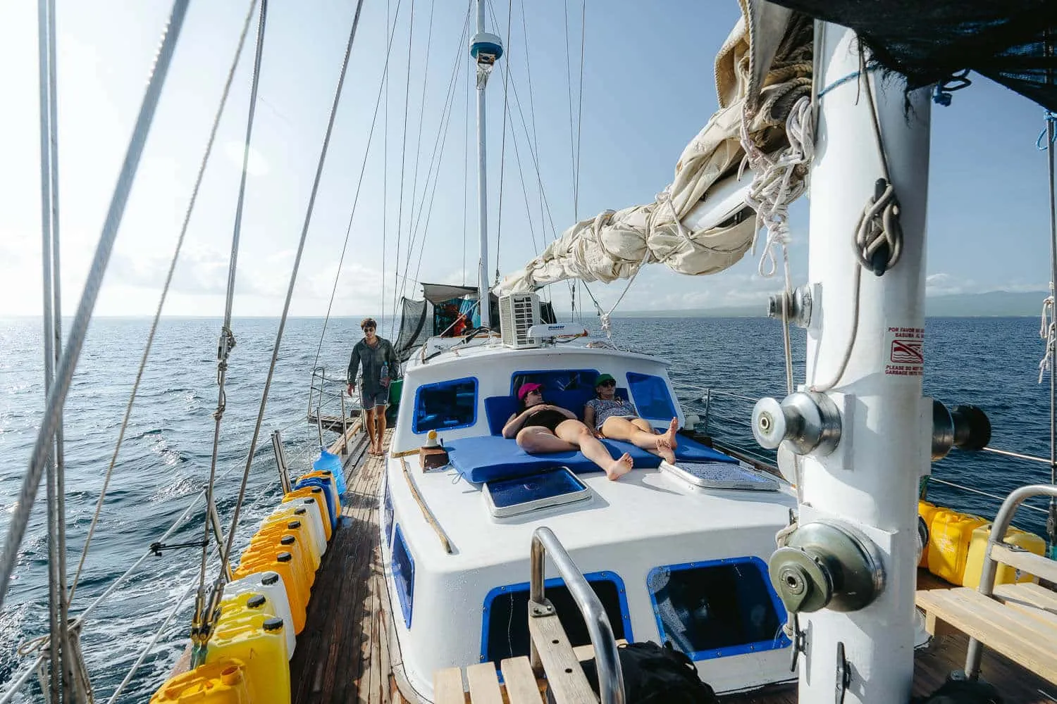 People sunbathing on the deck of our ship - Galapagos Cruise vs Island Hopping