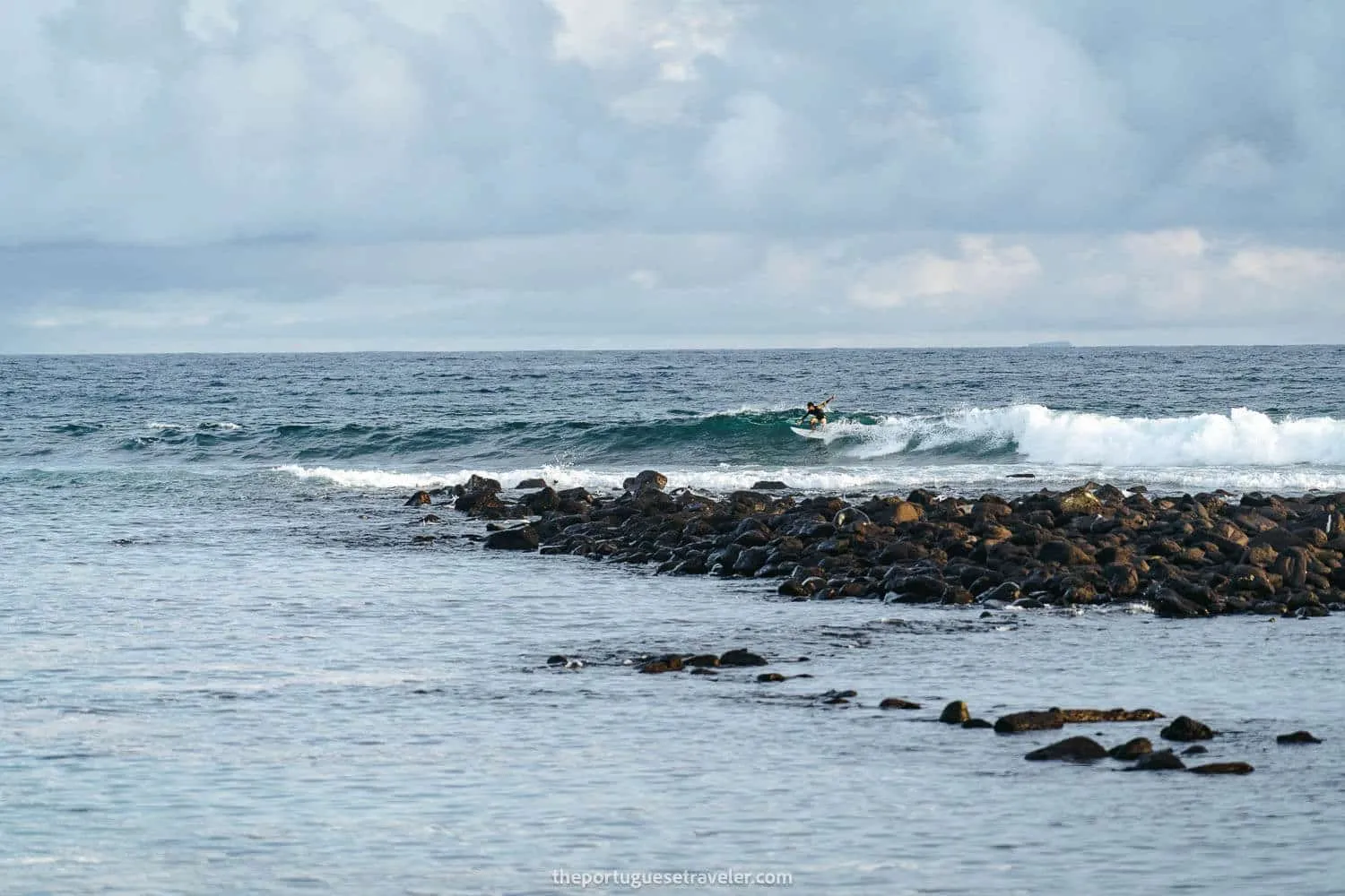 A surfer at La Loberia beach