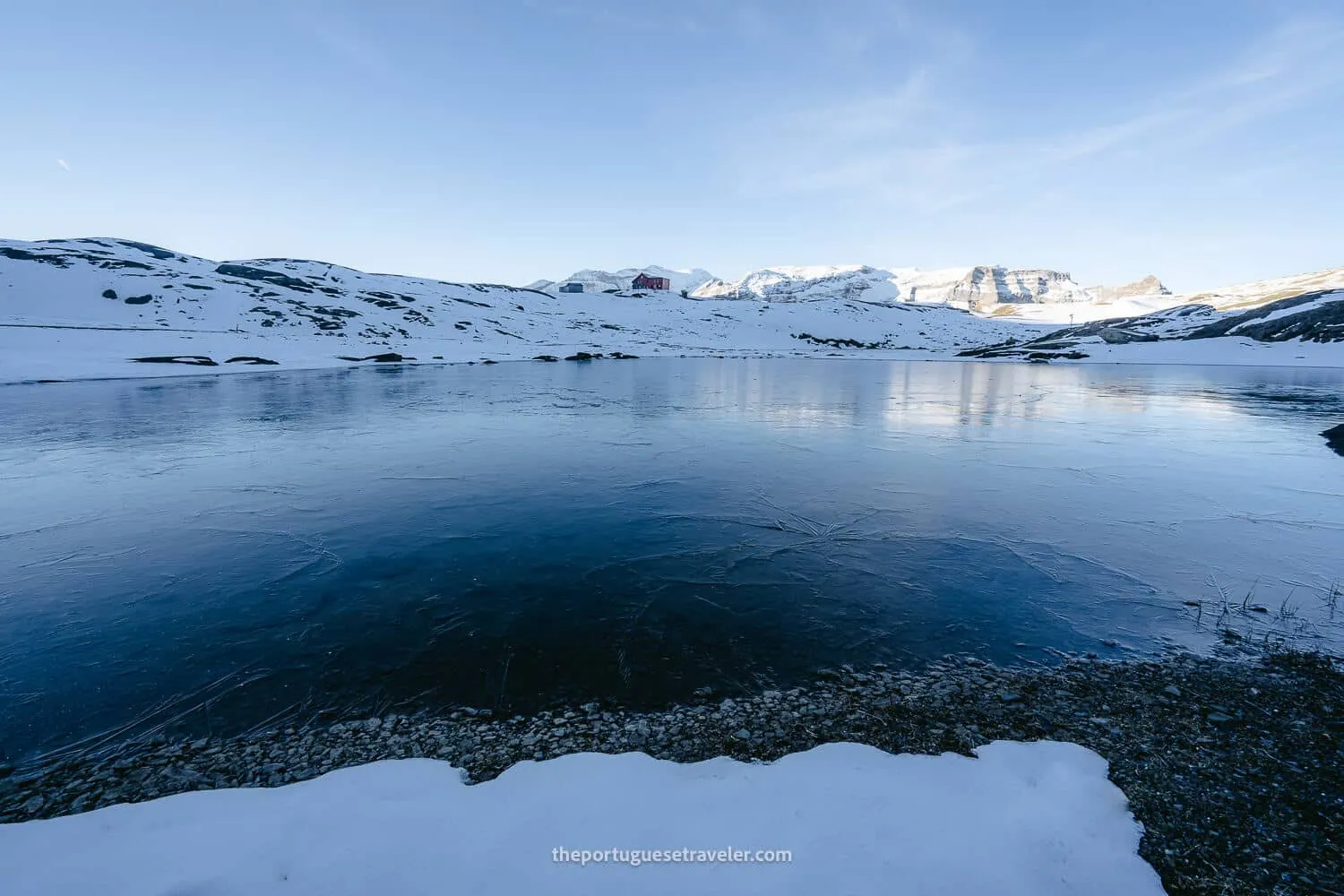 The Muttsee Hut over a frozen lake
