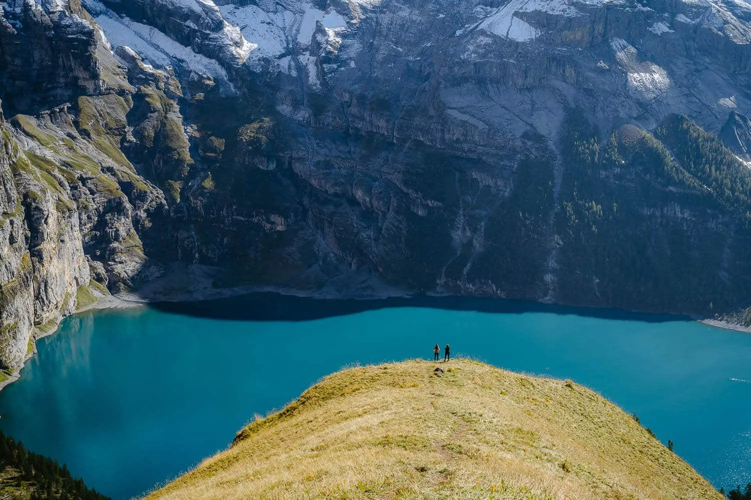Too hikers casually posing with this amazing background