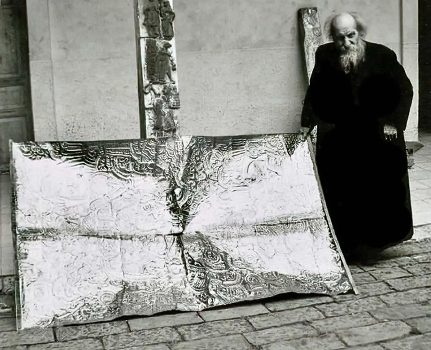 Father Crespi with an object from his collection
