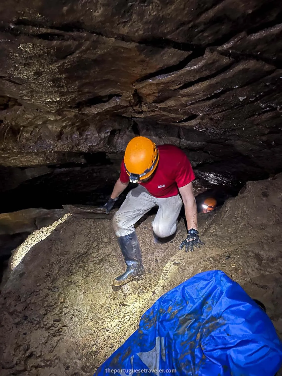 Me passing through a tight hole, where the backpack had to go first